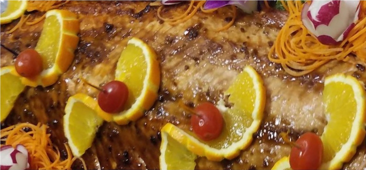 Glazed whole fish with oranges catered by Jerusalem Catering NJ